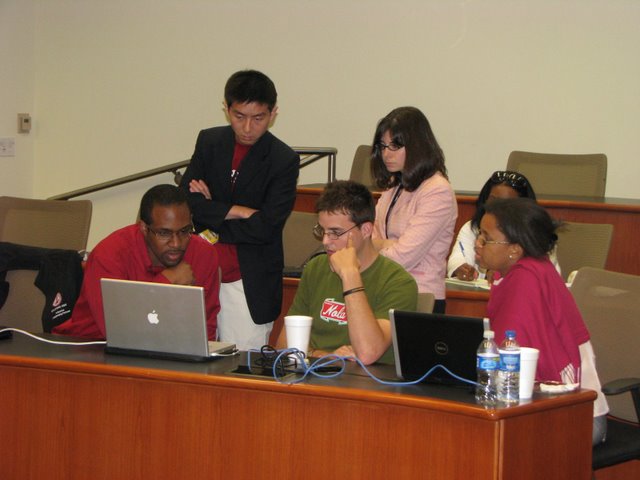 Students from Stanford University work with Kyle Berner, center, founder of Feelgoodz.