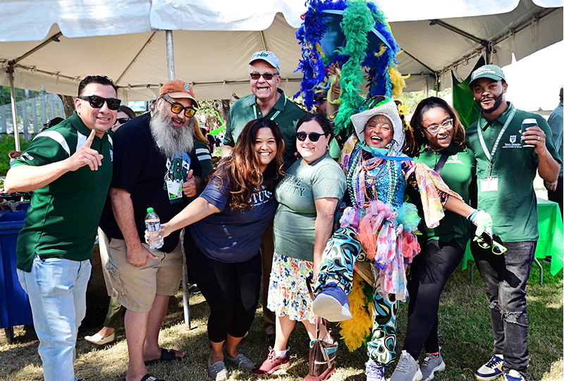 A group celebrating at a Tulane tailgate party