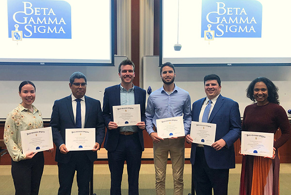 Fall 2023 Beta Gamma Sigma inductees show off their certificates