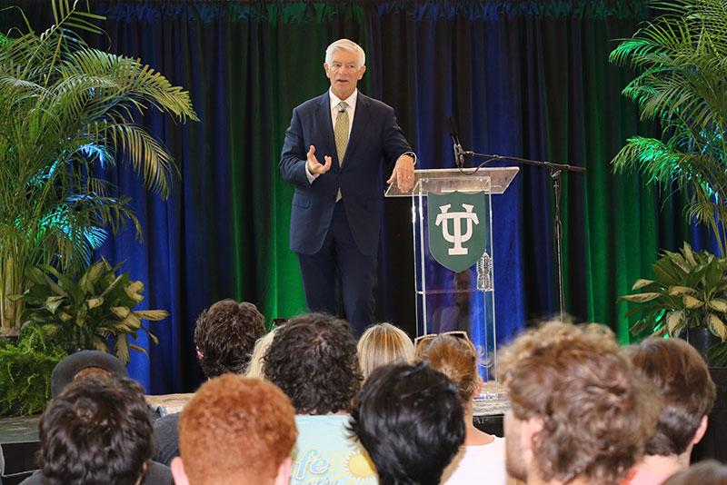 Patrick Harker delivers speech from stage in Freeman School's Marshall Family Commons.