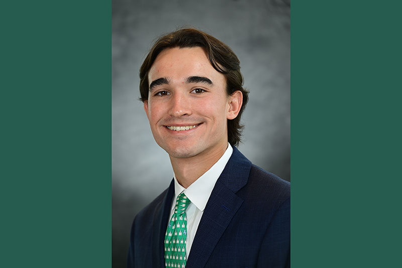 Jake Kuebel headshot with green bars