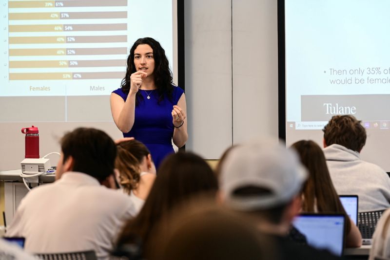 A graduate student giving a presentation. 