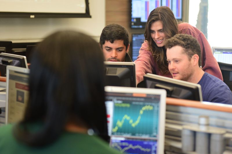 Students looking at computer data. 