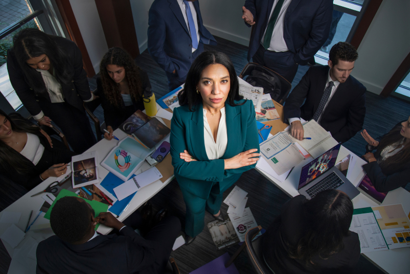 Chief Marketing Officer in office with team