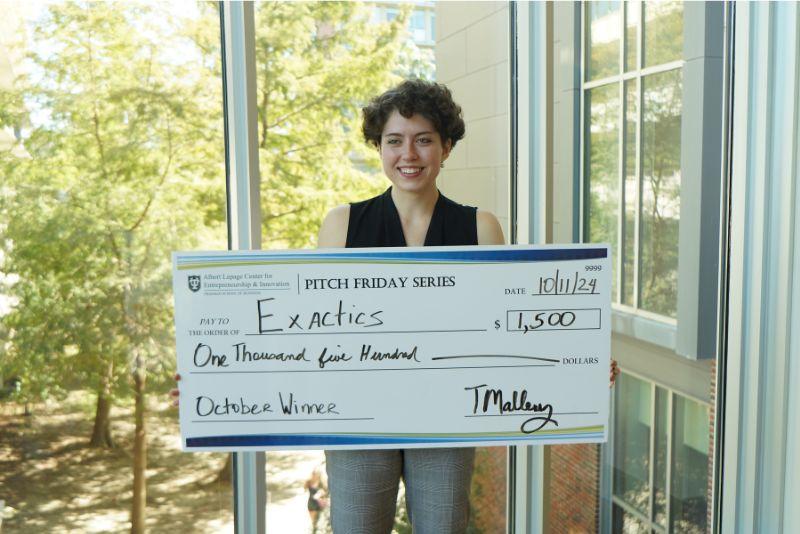 Dylan Murray with prize money. 