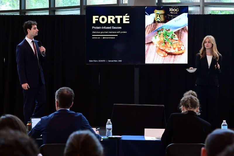 Forte Food team members stand before judges during Pitch Friday Competition 