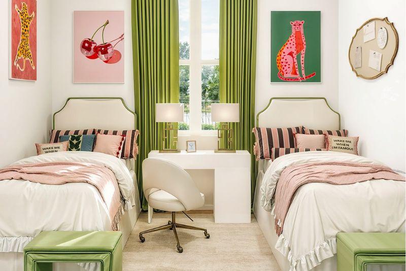 A dorm room styled in pink and green. 