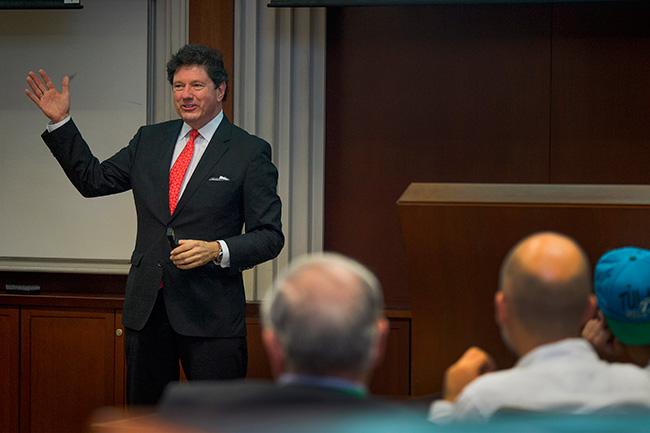 Peter Ricchiuti took alumni and parents on a whirlwind and lighthearted tour of the economy as part of this year's Homecoming Speaker Series. (Photo by Paula Burch-Celentano)