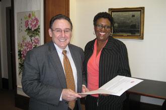 Sherri B. Thomas, right, director of early career facilitation at Phillips 66, presented Dean Ira Solomon with a $25,000 gift to support the Freeman School's energy programs.