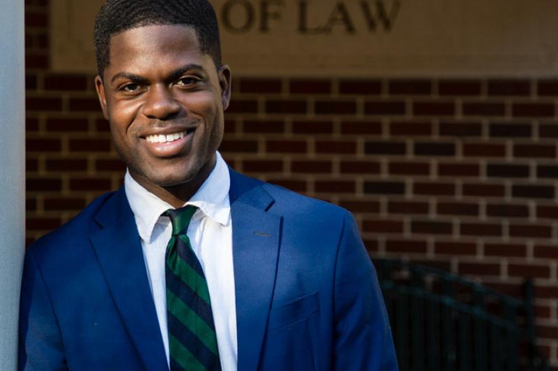 Kwasi Agyeman stands outside Tulane Law School