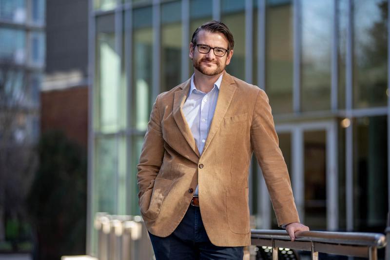 Rob Lalka in sports coat photographed outside Goldring/Woldenberg Business Complex