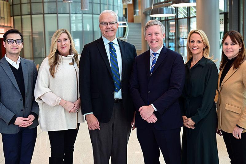 Freeman School of Business and Bernhard executives pose in the Goldring/Woldenberg Business Complex