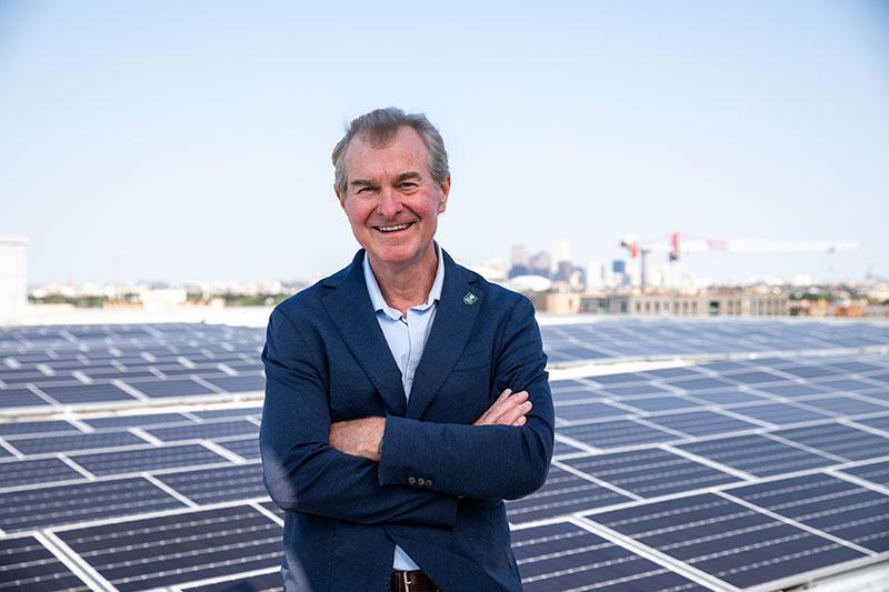 Pierre Conner on roof of Howard-Tilton Library