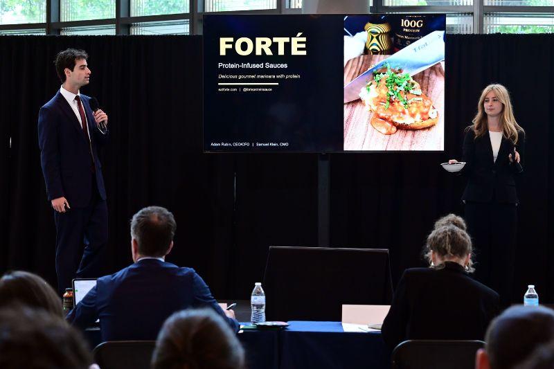 Forte Food team members stand before judges during Pitch Friday Competition 