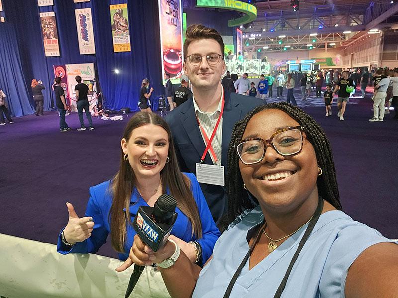 Macy Granger poses with media representatives at Super Bowl Experience