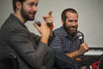 Tulane alumnus Erik Martin, right, general manager of Reddit, a wildly successful social news and entertainment website, and Alexis Ohanian, Reddit's co-founder, discuss the advantages of being a humanities major in a tech world. (Photo by Paula Burch-Celentano)