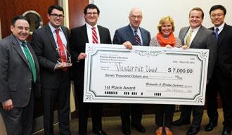 Dean Ira Solomon, left, and Rolanette and Berdon Lawrence, center, awarded this year's grand prize of $7,000 to a team from Vanderbilt University. 