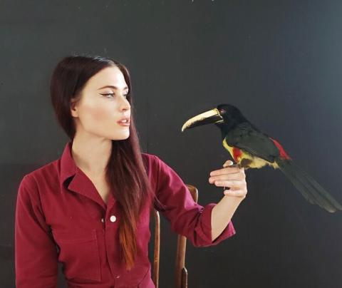 Portrait of Leslie Dalton with stuffed bird