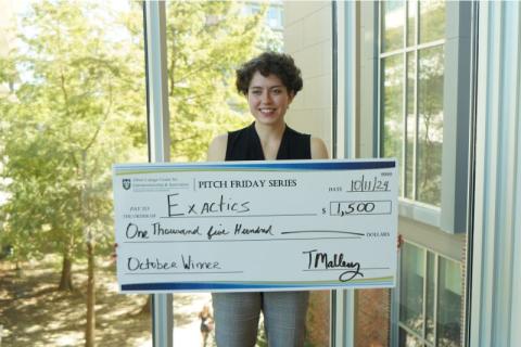 Dylan Murray with prize money. 