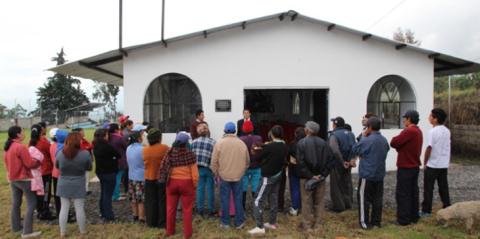 In Quito, Ecuador, neighborhood residents gather for the dedication of the new educational and recreation center that honors the memory of Beau Parent, who taught accounting at Tulane for 37 years.