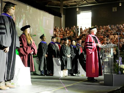 Tulane University Provost Robin Forman, center, delivers remarks during the Undergraduate Diploma Ceremony on May 19.
