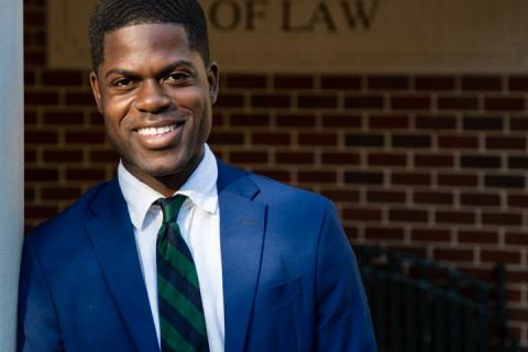 Kwasi Agyeman stands outside Tulane Law School