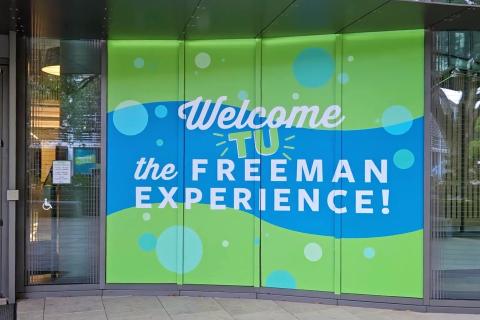 picture of a banner that says "Welcome to the Freeman Experience."