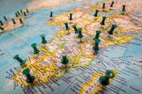 World Map with push pins photo by Paula Burch-Celentano