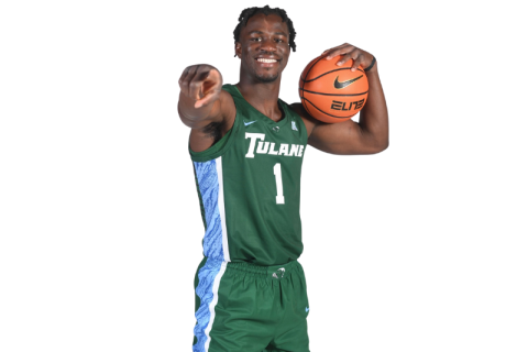 Sion James standing and pointing with basketball