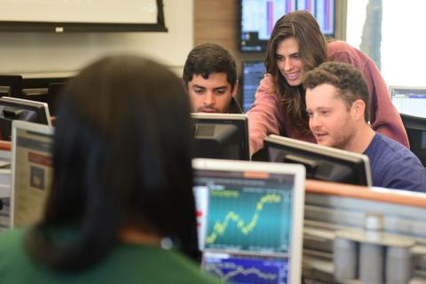 Students looking at computer data. 