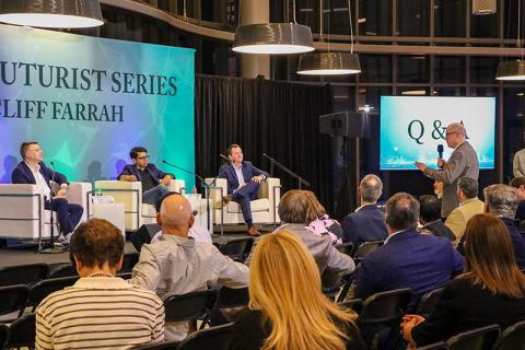 Alex Slepstov asks a question to the panelists at the first Freeman Futurist Series lecture.