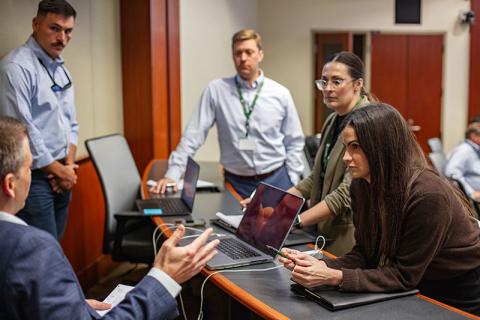 Five ENFRA managers work on a team project during the inagural session of the Elevate Executive Leadership Program