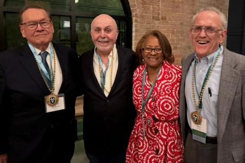Peggy Gibson standing with her classmates at her 50th MBA Reunion. 