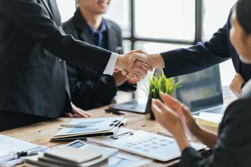 Adobe Stock photo of business people shaking hands