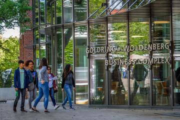 Students walking outside Goldring/Woldenberg Business Complex