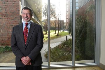 Russ Robins standing in front of window in GWBC