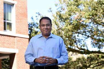 Venkat Subramaniam photographed outside the Goldring/Woldenberg Business Complex